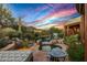 Desert landscape with a sparkling pool, spa, and covered patio; perfect for relaxing at 40523 N 102Nd Pl, Scottsdale, AZ 85262