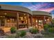 Covered patio with outdoor kitchen, dining area and stunning mountain views at 40523 N 102Nd Pl, Scottsdale, AZ 85262