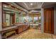 Spa-like bathroom with a large soaking tub, stone tile, and dual vanities at 40523 N 102Nd Pl, Scottsdale, AZ 85262