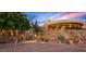View of a luxury home's exterior entrance with stone facade and desert landscaping at 40523 N 102Nd Pl, Scottsdale, AZ 85262