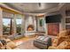 Cozy living room with a fireplace and patio access at 40523 N 102Nd Pl, Scottsdale, AZ 85262