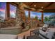 Large stone fireplace and seating area perfect for outdoor entertaining at 40523 N 102Nd Pl, Scottsdale, AZ 85262