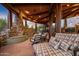 Relaxing patio with a stone fireplace and comfortable seating at 40523 N 102Nd Pl, Scottsdale, AZ 85262
