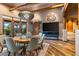 Rustic dining room with a live-edge table, wood beams, and a large chandelier at 40523 N 102Nd Pl, Scottsdale, AZ 85262