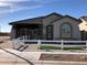 Model home showcasing modern design and curb appeal at 9963 W Cora Ln, Avondale, AZ 85392