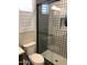 Modern bathroom with patterned tile shower and glass enclosure at 9963 W Cora Ln, Avondale, AZ 85392