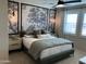 Main bedroom with large-scale nature wall art and plenty of natural light at 9963 W Cora Ln, Avondale, AZ 85392