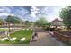 Relaxing lawn area with cornhole and shaded picnic area at 9963 W Cora Ln, Avondale, AZ 85392