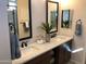Double vanity bathroom with modern fixtures and a large mirror at 9963 W Cora Ln, Avondale, AZ 85392