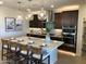 Modern kitchen with large island and stainless steel appliances at 9963 W Cora Ln, Avondale, AZ 85392