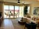 Bright living room with sliding glass doors opening to a patio and backyard at 9963 W Cora Ln, Avondale, AZ 85392