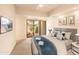 Guest bedroom with patio access and modern decor at 10044 E Graythorn Dr, Scottsdale, AZ 85262