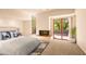 Main bedroom with fireplace and private access to patio at 10044 E Graythorn Dr, Scottsdale, AZ 85262