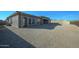 Spacious backyard with gravel landscaping and a covered patio at 13272 E La Junta Rd, Scottsdale, AZ 85255