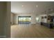 Open concept living space with hardwood floors and sliding doors to backyard at 13272 E La Junta Rd, Scottsdale, AZ 85255