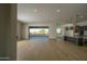 Open concept living space with hardwood floors and sliding doors to backyard at 13272 E La Junta Rd, Scottsdale, AZ 85255