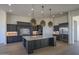 Modern kitchen with large island, stainless steel appliances, and custom cabinetry at 13272 E La Junta Rd, Scottsdale, AZ 85255