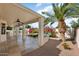 Relaxing covered patio with view of the landscaped backyard at 17828 W Mariposa Dr, Surprise, AZ 85374
