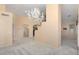 Open living room with high ceilings and chandelier at 17828 W Mariposa Dr, Surprise, AZ 85374