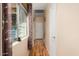 Light and bright hallway with wood-look flooring and window at 17828 W Mariposa Dr, Surprise, AZ 85374