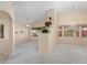 Spacious living room with high ceilings, chandelier, and large windows at 17828 W Mariposa Dr, Surprise, AZ 85374