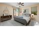 Bedroom with sliding door to patio and ceiling fan at 17828 W Mariposa Dr, Surprise, AZ 85374