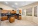 Kitchen boasts an island, ample cabinetry, and tiled floors at 17828 W Mariposa Dr, Surprise, AZ 85374
