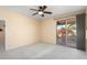Bright bedroom featuring sliding door to backyard patio at 17828 W Mariposa Dr, Surprise, AZ 85374