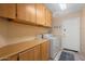 Bright laundry room with ample cabinet space at 17828 W Mariposa Dr, Surprise, AZ 85374