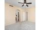 Spacious bedroom with ceiling fan and access to bathroom at 17828 W Mariposa Dr, Surprise, AZ 85374