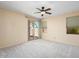 Bright bedroom with sliding glass door to backyard at 17828 W Mariposa Dr, Surprise, AZ 85374
