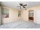 Well-lit bedroom with two windows and ensuite bathroom at 17828 W Mariposa Dr, Surprise, AZ 85374