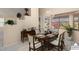 Dining room featuring a table, chairs, and a large window at 17828 W Mariposa Dr, Surprise, AZ 85374