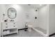 Clean bathroom with a walk-in shower, white subway tiles, and modern vanity at 3014 N 61St Pl, Scottsdale, AZ 85251