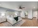 Main bedroom with ceiling fan, wood-look floors and calming decor at 3014 N 61St Pl, Scottsdale, AZ 85251