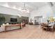 Open concept living room with a large sectional sofa and dining area at 3014 N 61St Pl, Scottsdale, AZ 85251