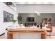 Open concept living area with a wood accent wall and a modern chandelier at 3014 N 61St Pl, Scottsdale, AZ 85251
