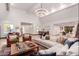 Bright and spacious living room with a large sectional sofa and high ceilings at 3014 N 61St Pl, Scottsdale, AZ 85251