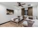 Guest bedroom with two twin beds, a ceiling fan, and large artwork at 3014 N 61St Pl, Scottsdale, AZ 85251