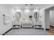 Spa-like bathroom with double vanity and mosaic tile floors at 3014 N 61St Pl, Scottsdale, AZ 85251