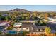 Aerial view of a remodeled mid-century modern home with pool and mountain views at 3014 N 61St Pl, Scottsdale, AZ 85251