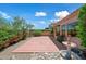 Peaceful backyard patio featuring a stone fountain and colorful flowers at 16914 E Britt Ct, Fountain Hills, AZ 85268