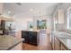 Open kitchen with breakfast bar and access to backyard at 16914 E Britt Ct, Fountain Hills, AZ 85268