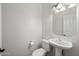 Clean bathroom with pedestal sink and octagon mirror at 16914 E Britt Ct, Fountain Hills, AZ 85268