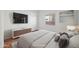 Bedroom with a large bed, TV and wood floors at 16914 E Britt Ct, Fountain Hills, AZ 85268