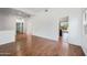 Living room with wood-look laminate flooring and kitchen view at 16914 E Britt Ct, Fountain Hills, AZ 85268