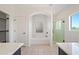 Bathroom with soaking tub, shower, and block windows at 16914 E Britt Ct, Fountain Hills, AZ 85268