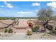 Single-story home with a two-car garage and desert landscaping at 16914 E Britt Ct, Fountain Hills, AZ 85268
