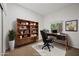 Home office with built-in shelving and a large desk at 16914 E Britt Ct, Fountain Hills, AZ 85268