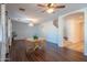 Open living room with hardwood floors and ceiling fan at 17186 W Post Dr, Surprise, AZ 85388
